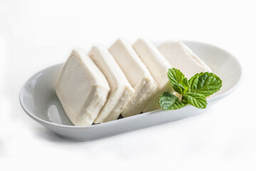 Nabulsi arabic cheese on white plate on a white background 