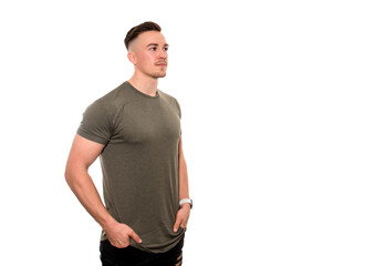 Fototapeta premium Handsome young and fit man in t-shirt with fitness watch on isolated background