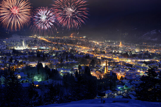 firework on sky over german city Garmisch-Partenkirchen at cold winter night