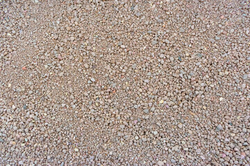 Sand on background. Grey cat litter backdrop. Bentonite natural clay texture.