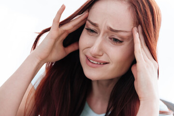 Woman suffering from severe headache. 