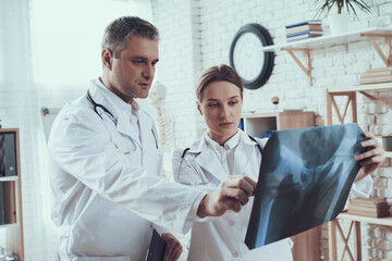 Man with stethoscope stands in the office