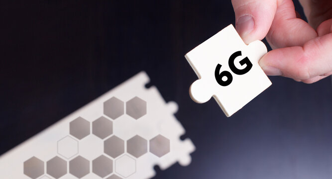 Business, Technology, Internet and network concept. Young businessman shows the word: 6G