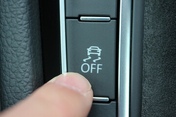 Finger on traction control button