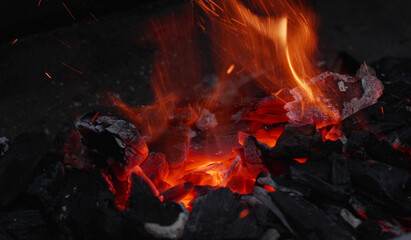 burning and glowing embers, glowing charcoal on a grill