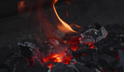 barbecue in the garden, close-up of glowing embers, grill in the garden, burins charcoal, ash...