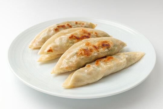 Grilled dumplings on a white background