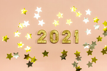Happy New 2021 Year. Gold numbers 2021 and stars on a light background.