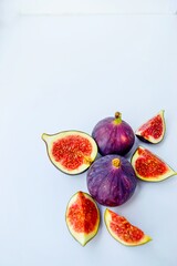 Bright juicy ripe figs on a white background cut into pieces. The concept of healthy food.