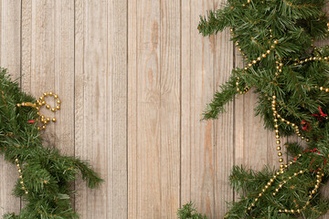 Christmas composition. Fir branches on a wooden horizontal background.