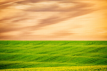 Idyllic sunlight on the wavy fields. Location place of South Moravia region, Czech Republic, Europe.