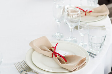 Table setting empty wine glasses and tablecloth