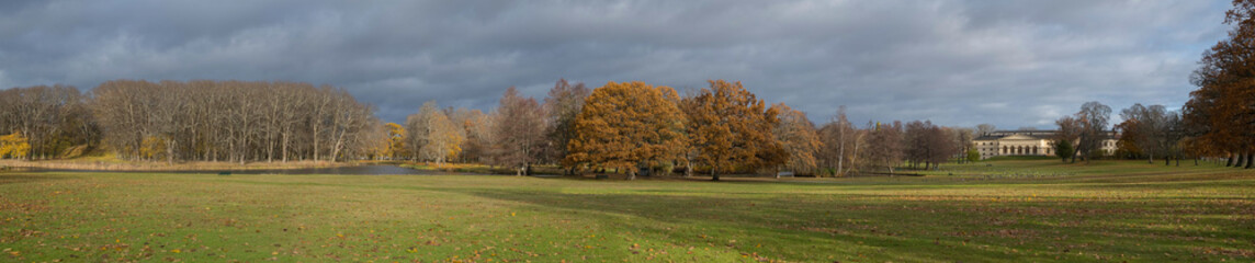 Naklejka premium Color full autumn in a park on the Drottningholm island in Stockholm