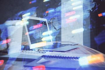 Double exposure of desktop computer and technology theme hologram. Concept of software development.