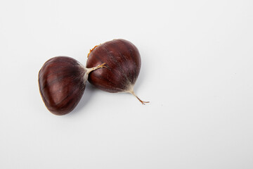 Many chestnuts, close up. White blackground.