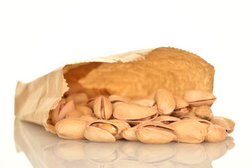 Delicious pistachios, close-up, on a white background.