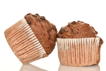 A few delicious chocolate muffins, close-up, on a white background.