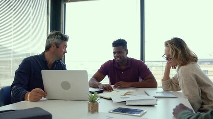 Mixed race group of business workers working together on collaboration project 