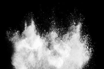 White powder explosion isolated on black background.