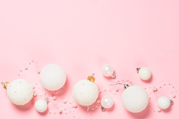 Christmas pink flat lay background with holiday decorations.