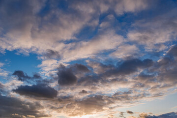 Naklejka na ściany i meble Amazing cloudscape on the sky at sunset time after rain