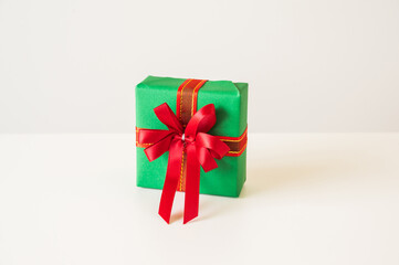 Gift box mockup on the white table with copy space. Merry christmas and happy new years background for text advertise.