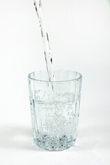 Pouring drinking clean water into the glass