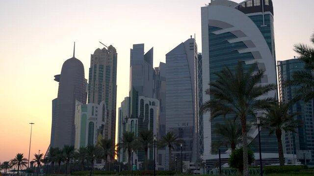 Doha, Qatar- 03 November 2020 :The skyline of Qatar city during sunset with gloomy sky . moving shot