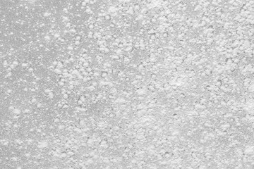 Flour on a colored background. A pile of flour on a white background. Spilled flour. Flour texture