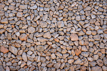 wall background with orange stones and dirt