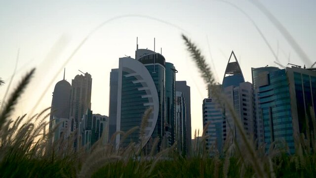 Doha, Qatar- 03 November 2020 :The skyline of Qatar city during sunset with gloomy sky . moving shot