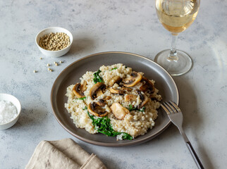 Risotto with mushrooms and spinach. Healthy food. Vegetarian food.