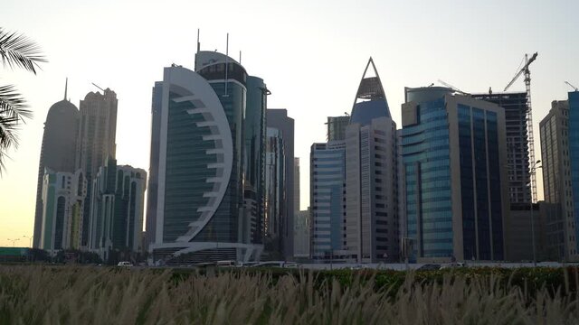 Doha, Qatar- 03 November 2020 :The skyline of Qatar city during sunset with gloomy sky . moving shot