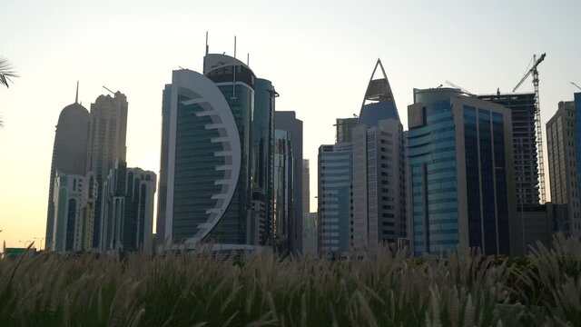 Doha, Qatar- 03 November 2020 :The skyline of Qatar city during sunset with gloomy sky . moving shot