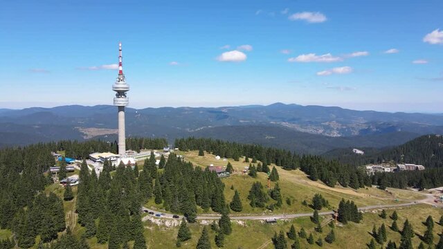 Aerial view of Rhodope Mountains and Snezhanka tower near resort of Pamporovo, Smolyan Region, Bulgaria