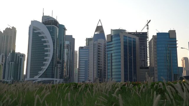 Doha, Qatar- 03 November 2020 :The skyline of Qatar city during sunset with gloomy sky . moving shot