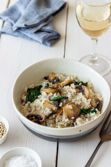 Risotto with mushrooms and spinach. Healthy food. Vegetarian food.