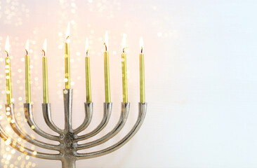 Religion image of jewish holiday Hanukkah background with menorah (traditional candelabra) and candles