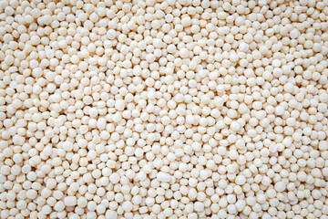 Uncooked pearl Israeli couscous (ptitim) background