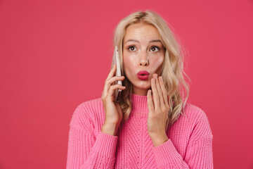 Image of a beautiful shocked young blonde woman