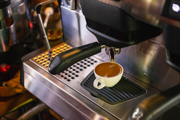 Barista prepares to make coffee with a coffee machine.