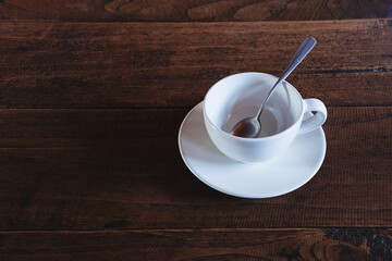  Empty coffee cup on wooden table