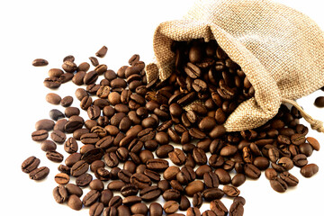 Canvas bag with scattered roasted aromatic coffee beans.