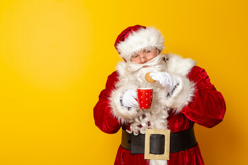 Fototapeta na wymiar Santa Claus eating cookies and drinking milk