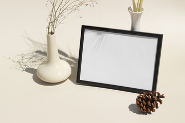 Empty black picture frame white background copy space with natural props