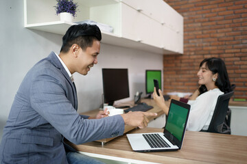 Fototapeta premium Portrait of happy coworkers. Having fun content