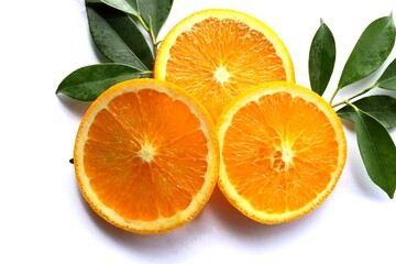 Orange fruit piece slices with green leaves fruits or vegetables isolated on white background closeup.