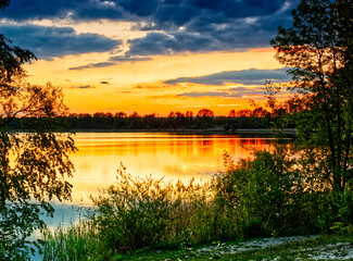 Fototapeta na wymiar Sunset full of colors at the Pogoria III Lake.