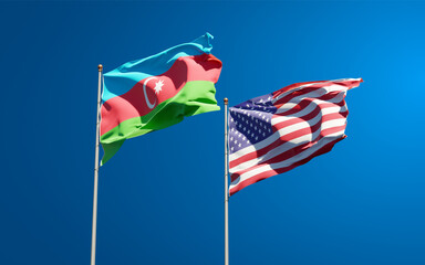 Beautiful national state flags of USA and Azerbaijan together at the sky background. 3D artwork concept.