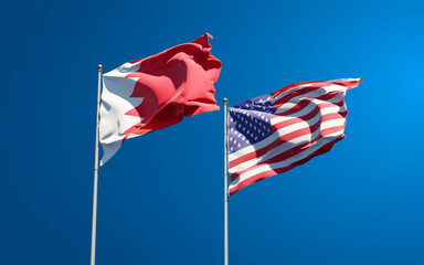 Beautiful national state flags of USA and Bahrain together at the sky background. 3D artwork concept. © Leo Altman